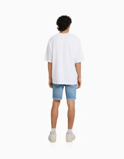 BERSHKA Bermuda denim skinny retroussé Bleu Store