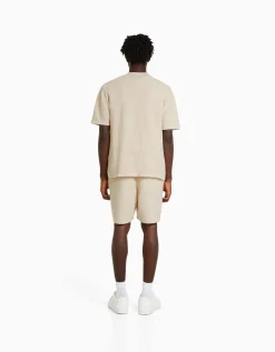 BERSHKA Chemise manches courtes basique texturée Écru Sale