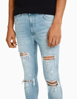 BERSHKA Jean skinny déchirures taches de peinture Bleu lavé Hot