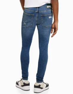 BERSHKA Jeans super skinny déchirés Bleu Hot