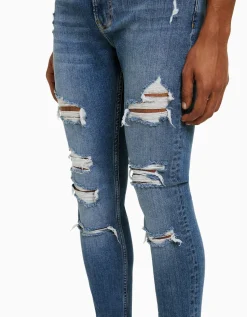 BERSHKA Jeans super skinny déchirés Bleu Hot