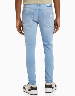 BERSHKA Jeans super skinny déchirés Bleu Outlet