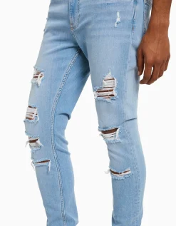 BERSHKA Jeans super skinny déchirés Bleu Outlet