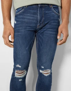 BERSHKA Jeans super skinny déchirés Bleu Store