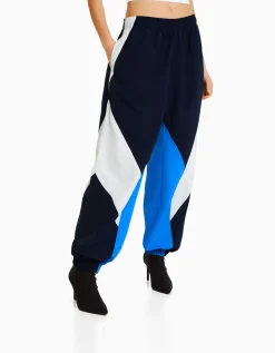 BERSHKA Pantalon jogger molleton effet nylon color block Bleu Best