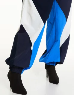 BERSHKA Pantalon jogger molleton effet nylon color block Bleu Best