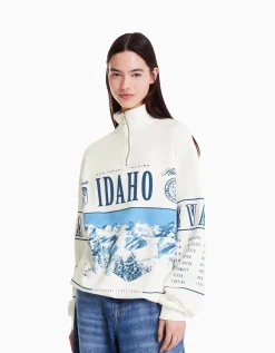 BERSHKA Sweat col montant zippé imprimé Blanc cassé Sale