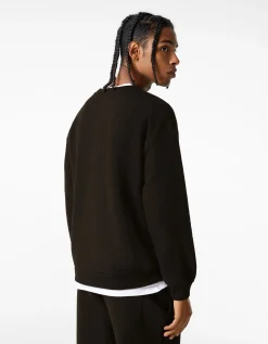 BERSHKA Sweat oversize col rond Noir Discount
