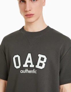 BERSHKA T-shirt molleton imprimé varsity Blanc cassé Shop
